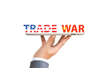 USA and China flag print screen to trade war wording with Businessman  who hold up tablet for risk managment during economic tariff trade war between both countries.