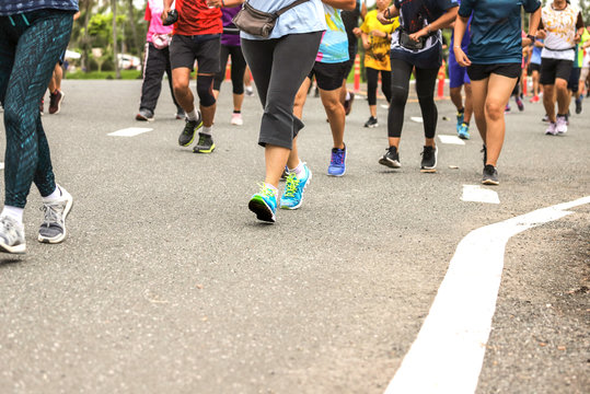 A  lot of people exercise Jogging , walking, run for health in the park,