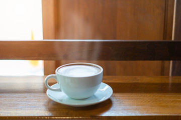 Hot Coffee Late Art on Wood Table in Coffee Shop