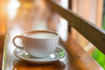 Hot Coffee Late Art on Wood Table in Coffee Shop