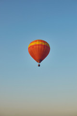 Balloon soaring into the sky.
