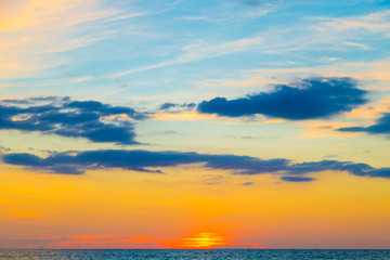 Naklejka na ściany i meble Silhouette sunset sea beach colorful sky