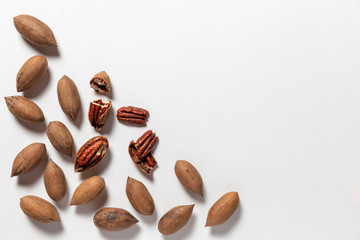 Group of pecan nuts on the white background