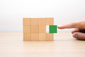 Hand Choosing wooden block,wood cubes Arrange stacking with out graphic for Business concept growth...