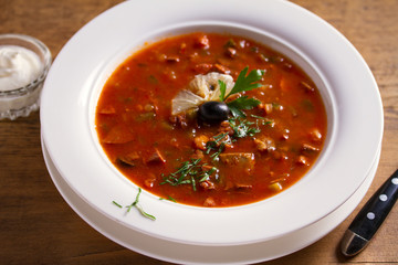 Traditional Russian dish  solyanka - thick, spicy and sour saltwort soup