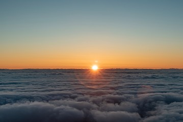 Fototapeta premium sunrise over the fluffy clouds with beautiful colours