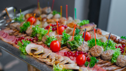 buffet meat platter with cherry tomatoes