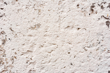 Texture of a concrete wall with cracks and scratches which can be used as a background
