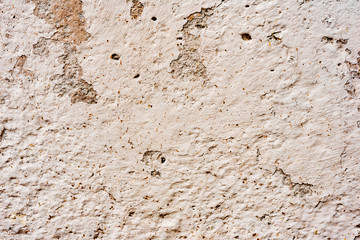 Texture of a concrete wall with cracks and scratches which can be used as a background
