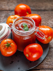 Tomato red sauce in glass bottle  with copy space for food issue, recipe or cooking.
