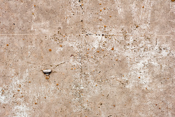 Texture of a concrete wall with cracks and scratches which can be used as a background