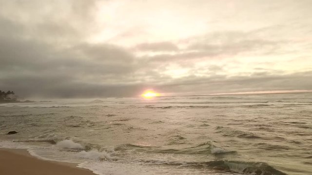 Aerial Fly By Of Caucasian Woman Photographing A Sunset