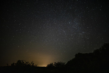 Fototapeta na wymiar Awesome starry night sky with beam of light