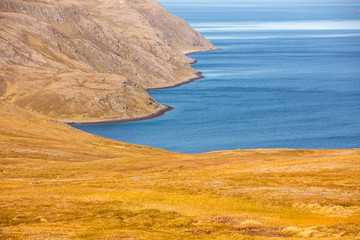 Barents sea. Beautiful rocky seashore Shoreline in northern Norway. Wild nature of Norway. Nordkapp, Mageroya island