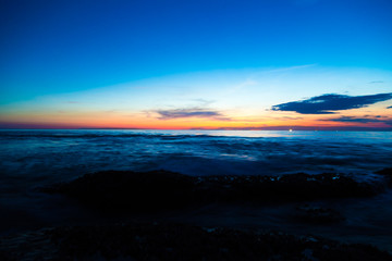 Fototapeta na wymiar Silhouette sunset sea beach colorful sky