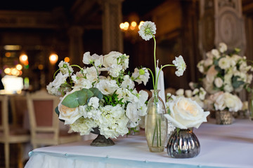elegant wedding serving with white roses and candles