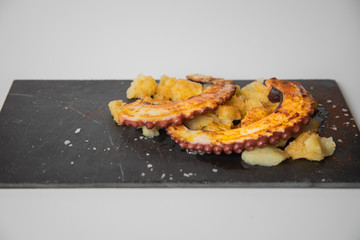 Octopus with paprika, potatoes and olive oil is a typical tapa from Galicia, Spain