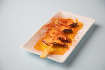 skewer, octopus with paprika, typical tapa in galicia spain