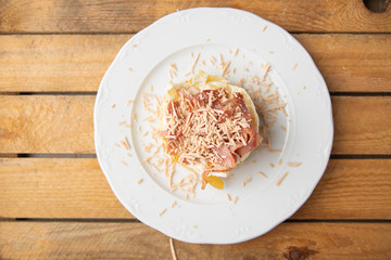 Spanish tapa, potato, fried egg, bacon and foie