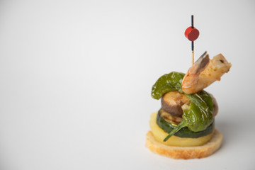 Spanish tapa, prawn skewer with mushroom pepper bread and potato
