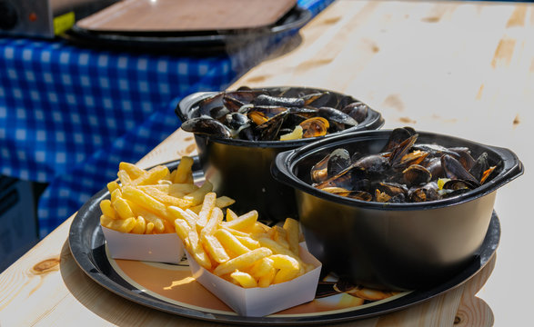 Traditional dish on Lille Braderie, mussels and fries (moules frites).Great Lille Braderie (Braderie de Lille).
