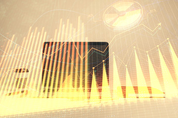 Forex graph hologram with desktop office computer background. Double exposure. Concept of financial analysis.