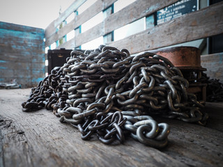 Pile of chains and a chainblock in the back of a flatbed truck.