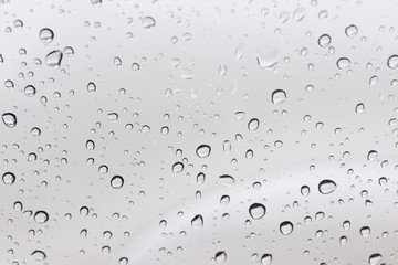 Rain drops on window glass surface background