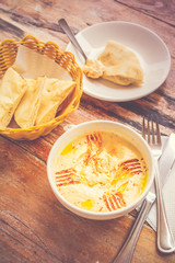 Hummus Pureed chickpeas, tahini, lemon, garlic drizzled with extra virgin oil served with pita bread