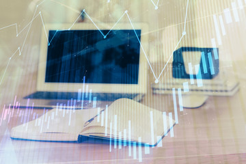 Stock market graph on background with desk and personal computer. Multi exposure. Concept of financial analysis.