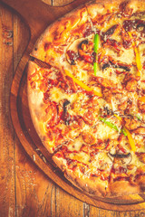 Supreme Pizza Tomato sauce, mozzarella cheese, chicken sausage, bacon, mushroom, red/ green capsicum and black olives
