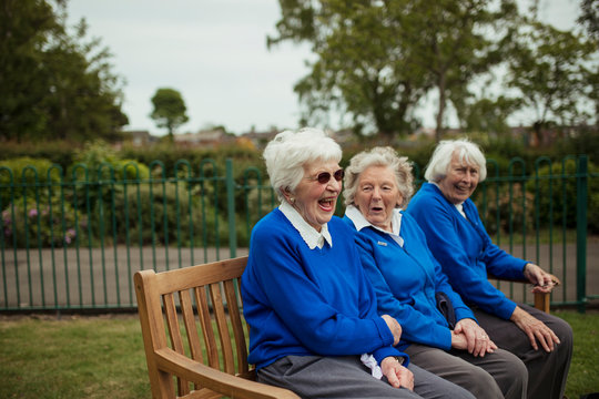 Senior Women Laughing on a Bench