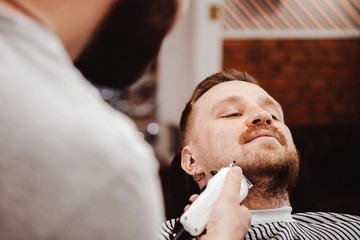 Professional trimming beard with a clipper