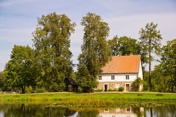 House at the lake bank in autumn. Latvia