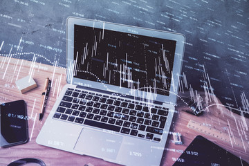 Multi exposure of chart and financial info and work space with computer background. Concept of...