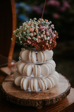 white macarons with flowers on top