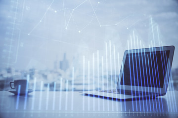 Forex graph hologram on table with computer background. Multi exposure. Concept of financial markets.