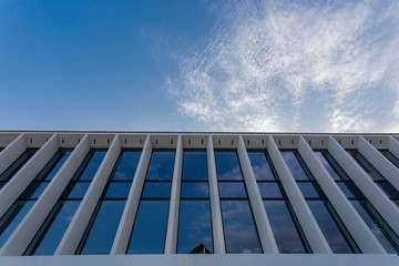 Fototapeta na wymiar sky and exterior glass wall modern building. Modern office building