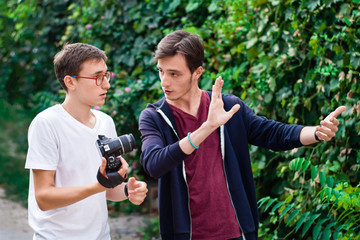 Young man photographer having a conversation