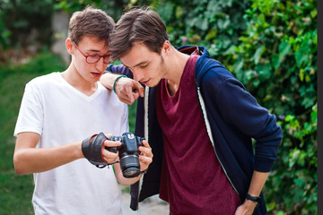 Young man photographer having a conversation