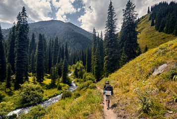 Fototapeta na wymiar Hiker with backpack in the mountains