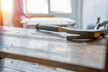 Carpenter building a house and workimg.