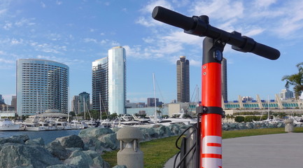Dockless scooter against SD skyline