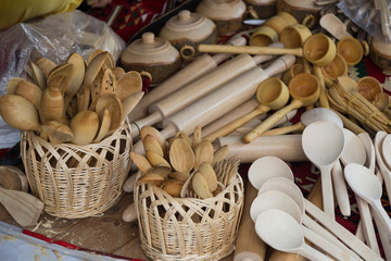wooden kitchen materials and spoons are in the shop.