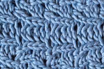 Knitted woolen textured surface, macro. Soft grey blue merino wo