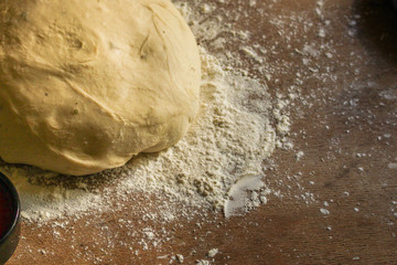 dough raw, flour, rolling pin for rolling (preparation for cooking) menu concept. food background. copy space