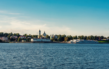 Fototapeta na wymiar View of the city Myshkin from the Volga river at sunset