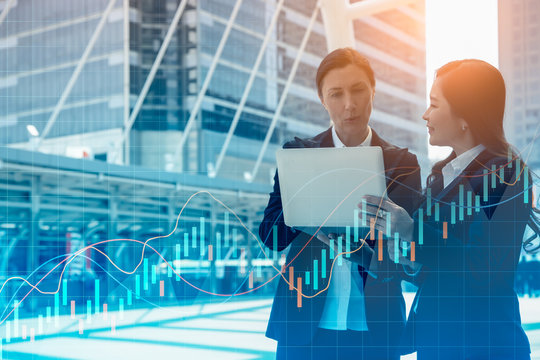 Team work process. Two women with laptop in open space office.World digital concept.Block chain.business and technology concept.