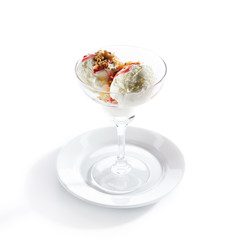 Two Ice Cream Balls or Iced Cream with Strawberry Sauce and Nuts