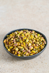 pistachio nuts on granite surface